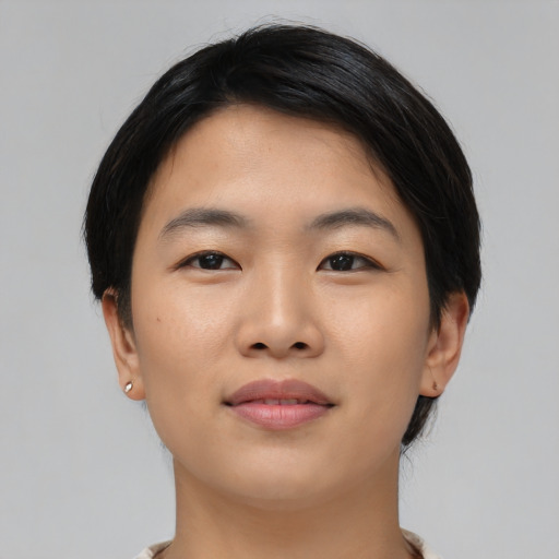 Joyful asian young-adult female with medium  black hair and brown eyes
