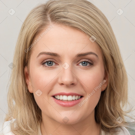 Joyful white young-adult female with medium  brown hair and blue eyes