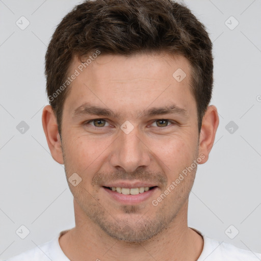 Joyful white young-adult male with short  brown hair and brown eyes