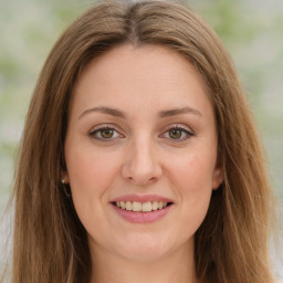 Joyful white young-adult female with long  brown hair and green eyes