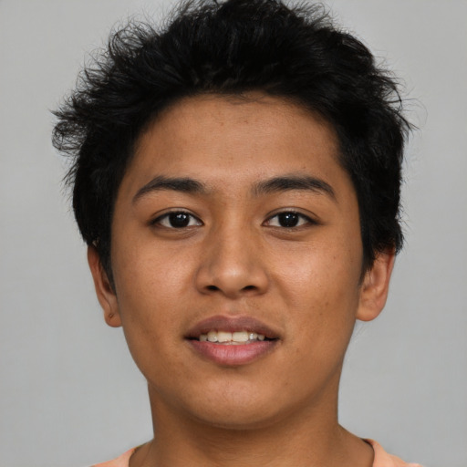 Joyful asian young-adult male with short  black hair and brown eyes