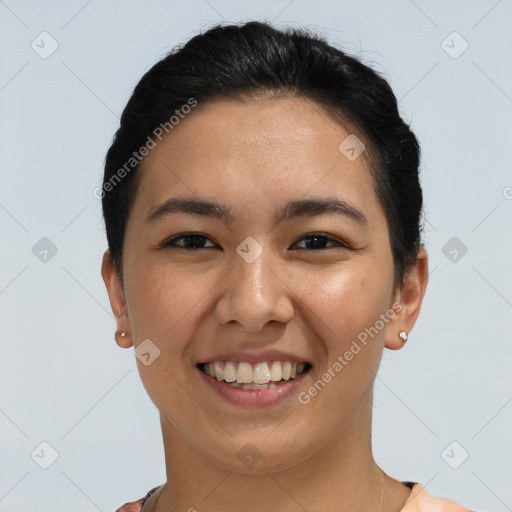 Joyful asian young-adult female with short  black hair and brown eyes