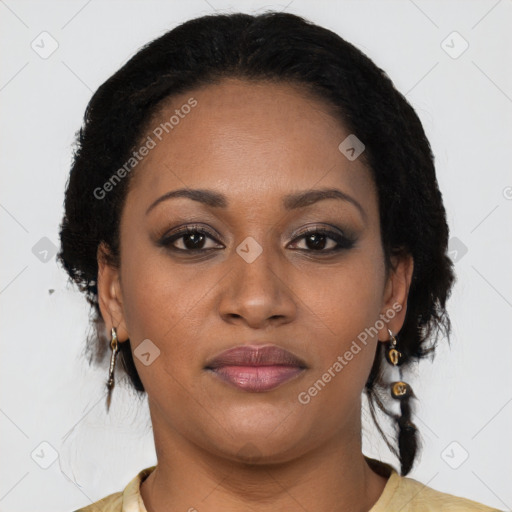 Joyful black adult female with medium  brown hair and brown eyes