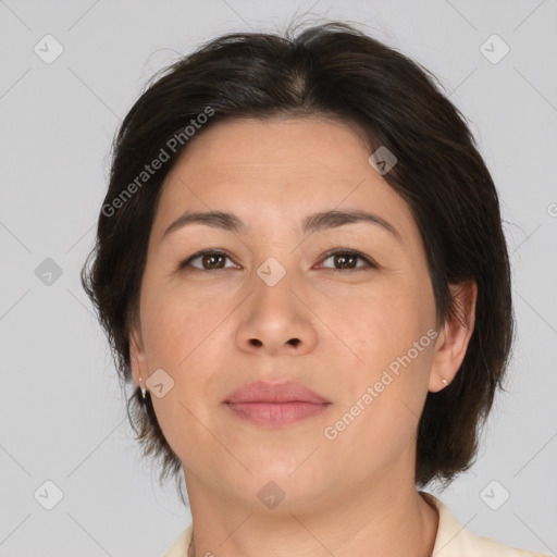 Joyful asian adult female with medium  brown hair and brown eyes