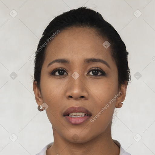 Joyful asian young-adult female with short  black hair and brown eyes