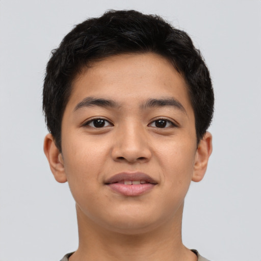 Joyful asian young-adult male with short  brown hair and brown eyes