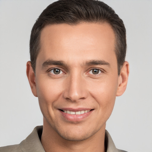 Joyful white young-adult male with short  brown hair and brown eyes