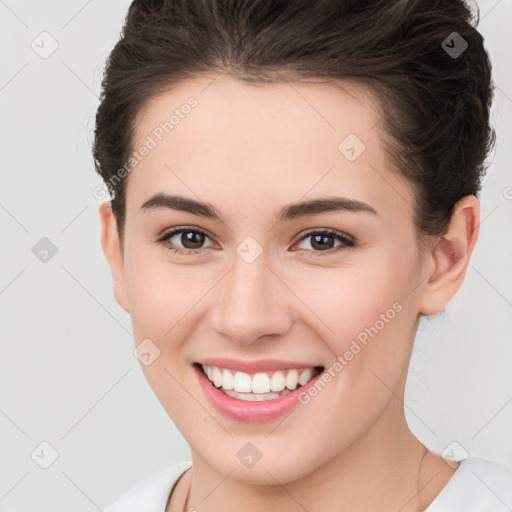 Joyful white young-adult female with medium  brown hair and brown eyes