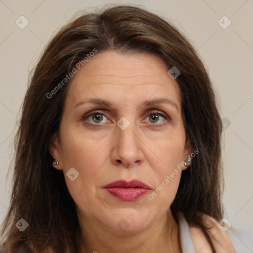 Joyful white adult female with long  brown hair and brown eyes