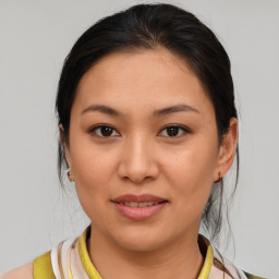 Joyful white young-adult female with medium  brown hair and brown eyes