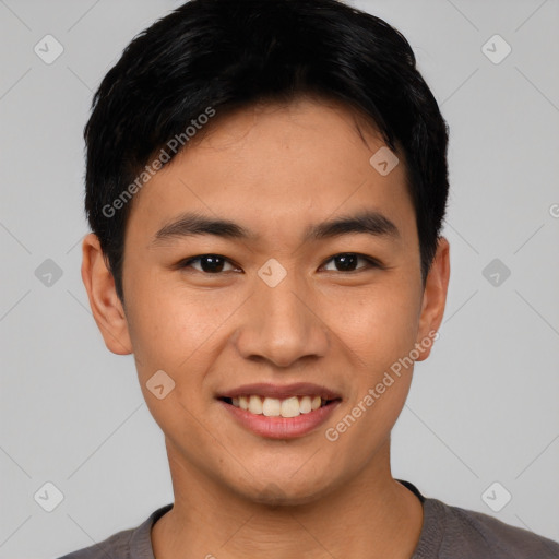 Joyful asian young-adult male with short  black hair and brown eyes