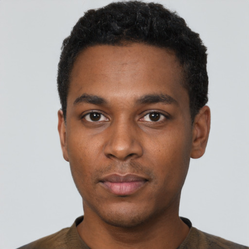 Neutral black young-adult male with short  black hair and brown eyes