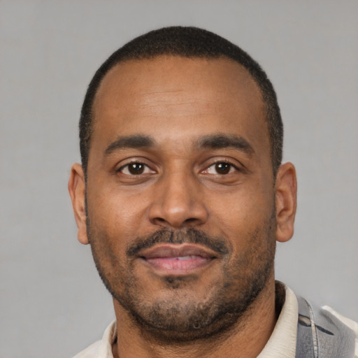 Neutral latino adult male with short  black hair and brown eyes
