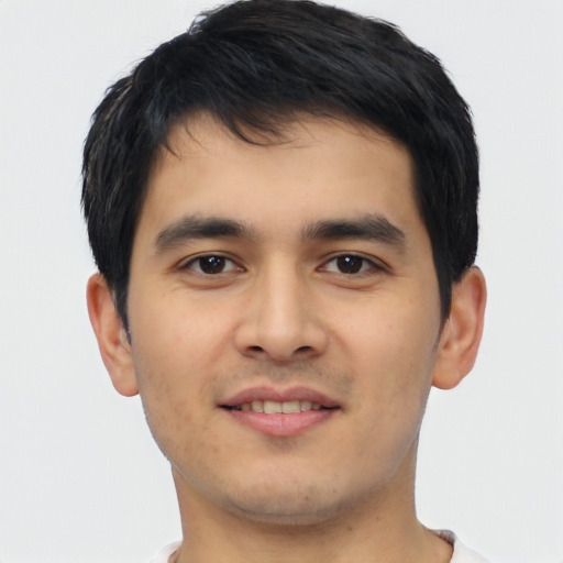 Joyful asian young-adult male with short  black hair and brown eyes