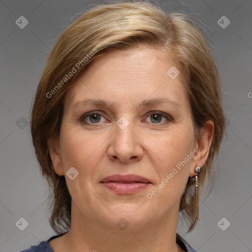 Joyful white adult female with medium  brown hair and brown eyes