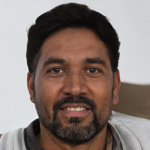 Neutral black adult male with short  black hair and brown eyes