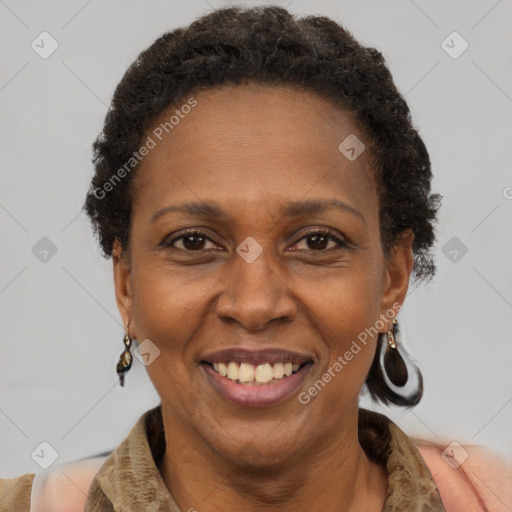 Joyful black adult female with short  brown hair and brown eyes