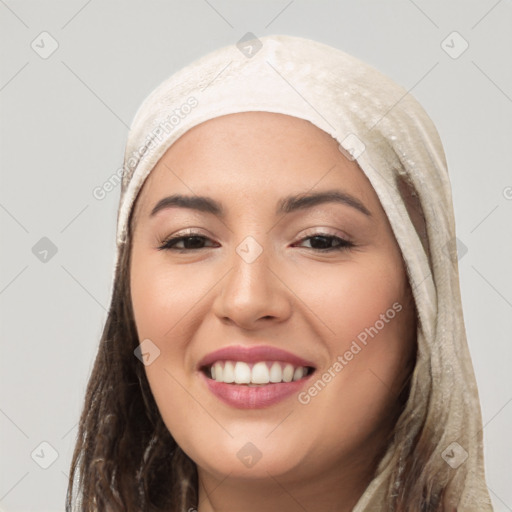 Joyful white young-adult female with long  black hair and brown eyes