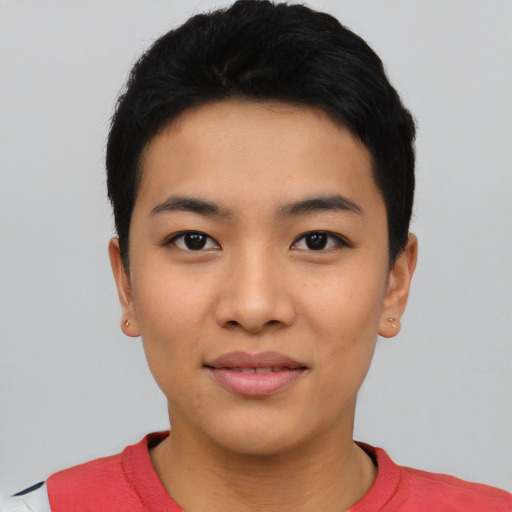 Joyful asian young-adult female with short  black hair and brown eyes