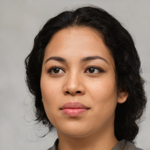 Joyful asian young-adult female with medium  black hair and brown eyes