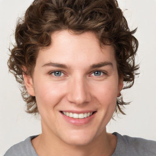 Joyful white young-adult female with medium  brown hair and blue eyes