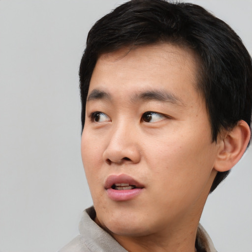 Neutral asian young-adult male with short  black hair and brown eyes