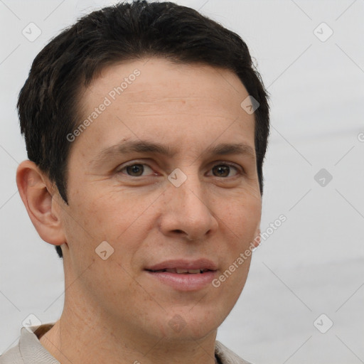 Joyful white adult male with short  brown hair and brown eyes