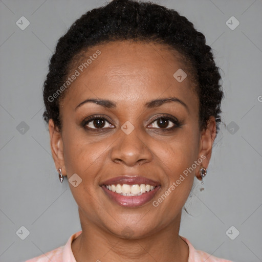 Joyful black young-adult female with short  brown hair and brown eyes