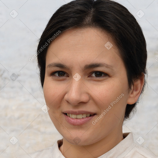 Joyful white young-adult female with medium  brown hair and brown eyes