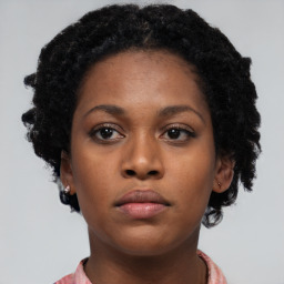 Neutral black young-adult female with short  black hair and brown eyes