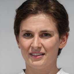 Joyful white adult female with short  brown hair and brown eyes