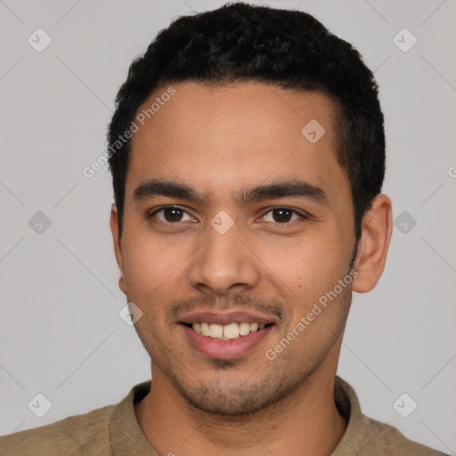 Joyful latino young-adult male with short  black hair and brown eyes