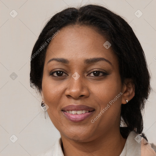 Joyful black adult female with medium  black hair and brown eyes