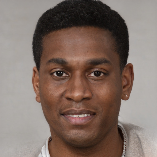 Neutral black young-adult male with short  black hair and brown eyes