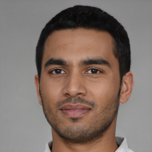 Neutral latino young-adult male with short  black hair and brown eyes