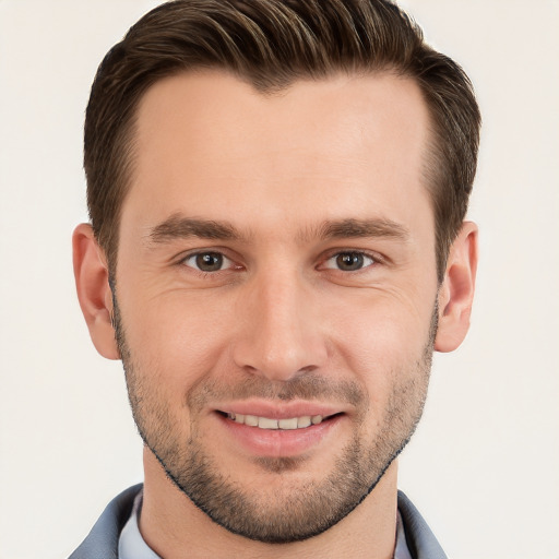 Joyful white young-adult male with short  brown hair and brown eyes