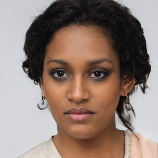 Neutral black young-adult female with long  brown hair and brown eyes