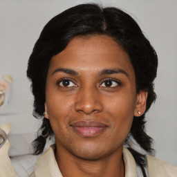 Joyful latino young-adult female with medium  black hair and brown eyes