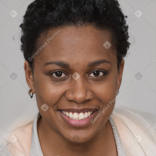 Joyful black young-adult female with short  brown hair and brown eyes