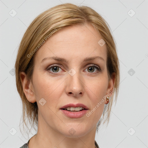 Joyful white adult female with medium  brown hair and grey eyes