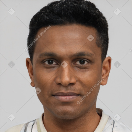 Joyful black young-adult male with short  black hair and brown eyes