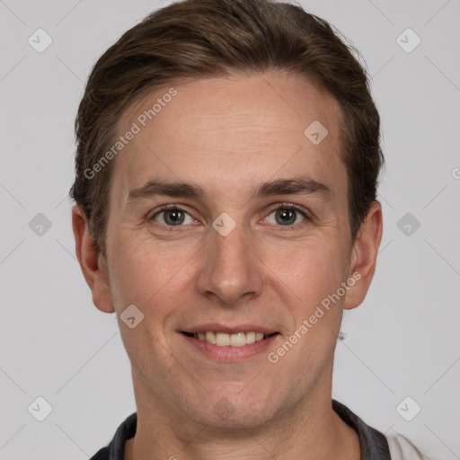 Joyful white adult male with short  brown hair and grey eyes