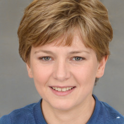 Joyful white young-adult female with short  brown hair and blue eyes