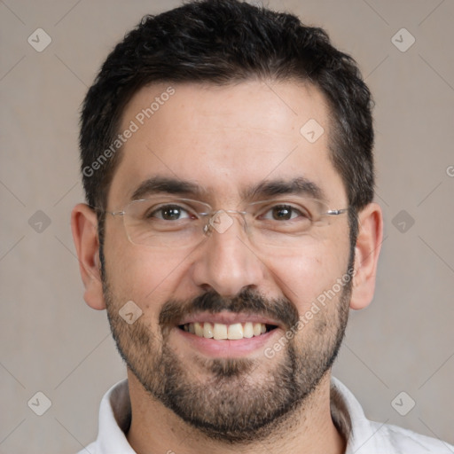 Joyful white adult male with short  black hair and brown eyes