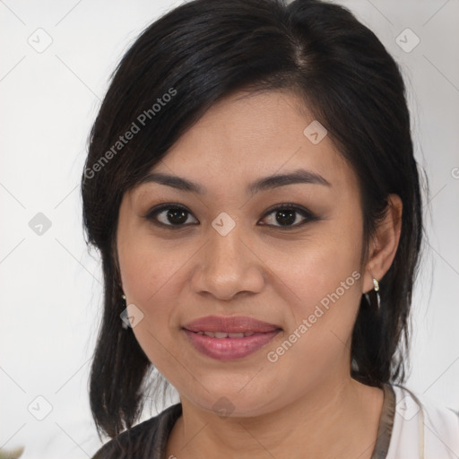 Joyful latino young-adult female with medium  brown hair and brown eyes