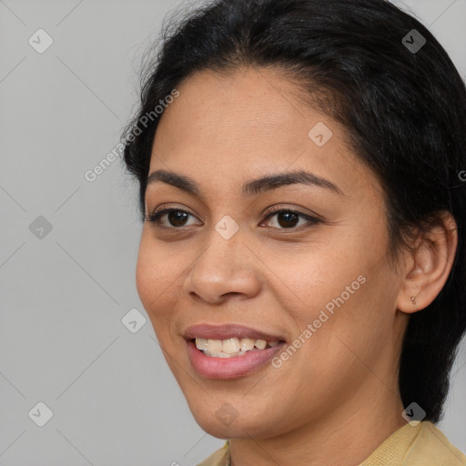 Joyful latino young-adult female with medium  brown hair and brown eyes