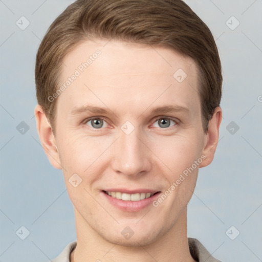 Joyful white young-adult female with short  brown hair and grey eyes