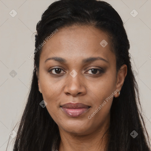 Joyful black young-adult female with long  black hair and brown eyes