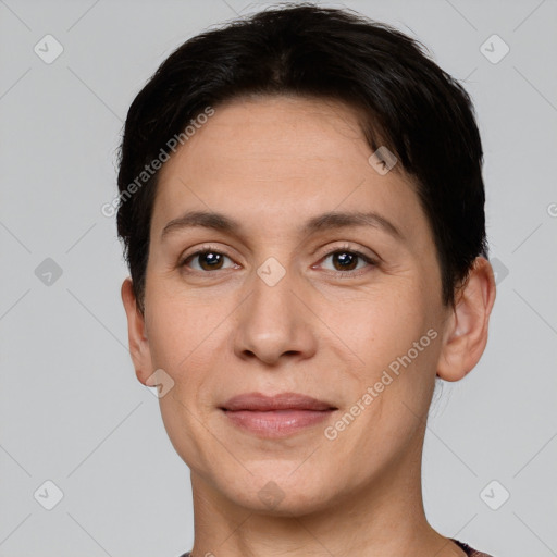 Joyful white adult female with short  brown hair and brown eyes