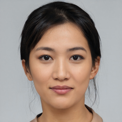 Joyful latino young-adult female with medium  black hair and brown eyes